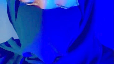 Muslim mistress wife in hijab putting a condom on big strapon